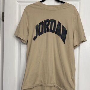 NWOT- Jordan Rattan Beige T-Shirt with Plaid lettering and Jordan logo on sleeve